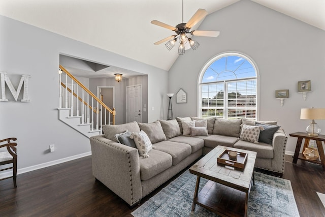 living area featuring baseboards, stairs, high vaulted ceiling, and dark wood-style flooring