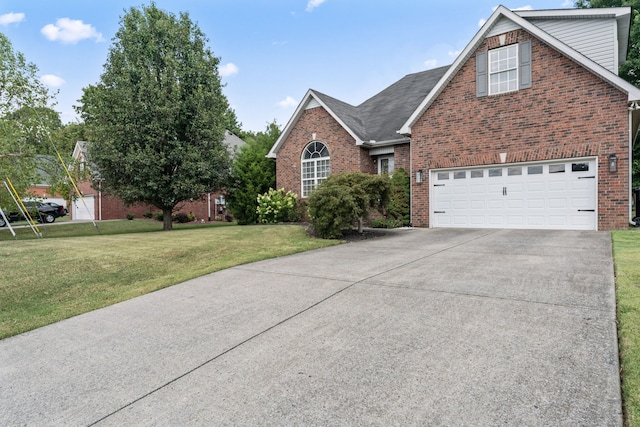 view of front facade featuring a front lawn and a garage