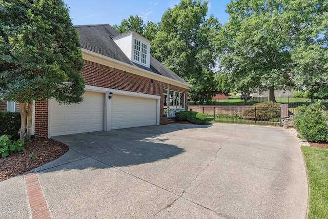 view of side of home with a garage