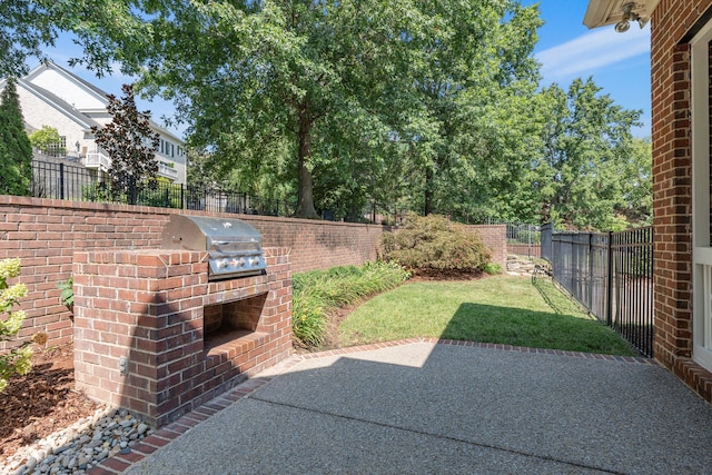 view of patio / terrace with area for grilling and a grill