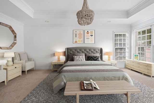 carpeted bedroom featuring a raised ceiling, crown molding, and a chandelier