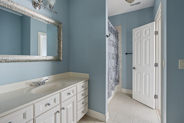 bathroom featuring tile patterned flooring, vanity, and shower / tub combo