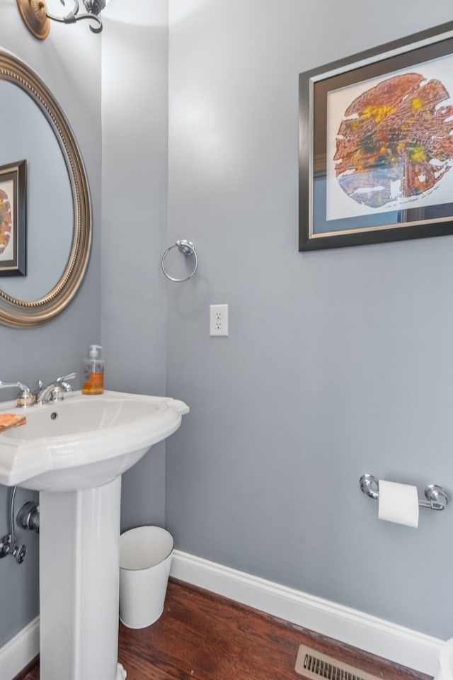 bathroom with hardwood / wood-style flooring