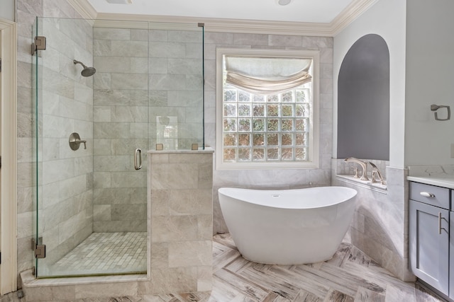 bathroom featuring parquet flooring, ornamental molding, plus walk in shower, and vanity