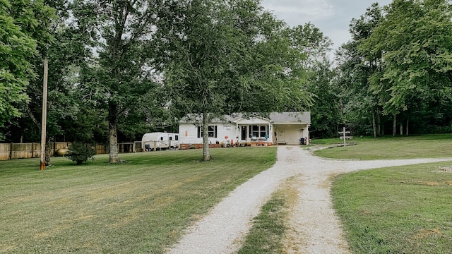 single story home featuring a front yard