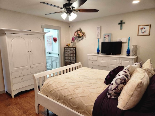 bedroom with dark wood-style floors, recessed lighting, ceiling fan, and ensuite bathroom