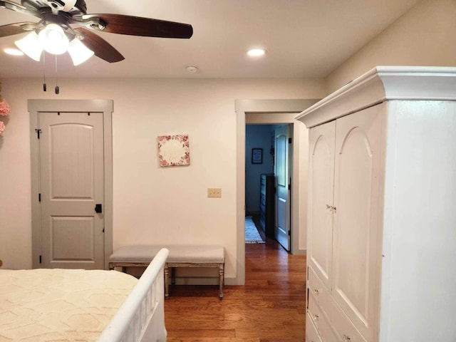 bedroom with a closet, a ceiling fan, dark wood-style flooring, and recessed lighting