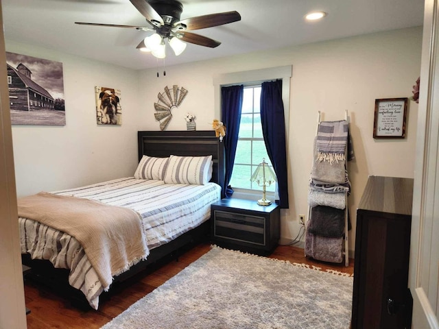 bedroom featuring a ceiling fan, recessed lighting, and dark wood finished floors