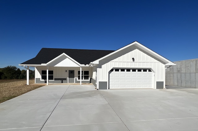 modern inspired farmhouse featuring a garage