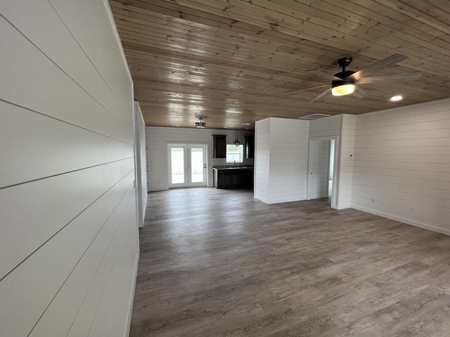 unfurnished living room with dark wood-style floors, wooden ceiling, a ceiling fan, and a sink