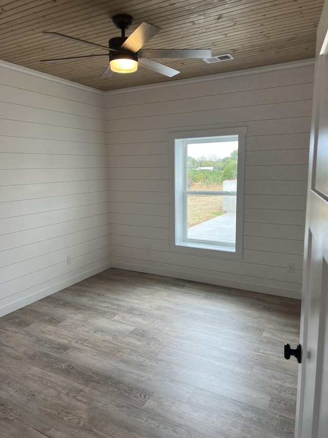 spare room featuring ceiling fan, baseboards, wood ceiling, and wood finished floors