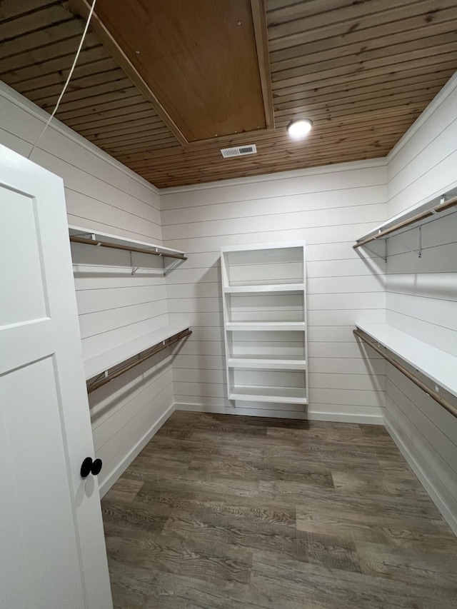 spacious closet with visible vents and dark wood-style floors