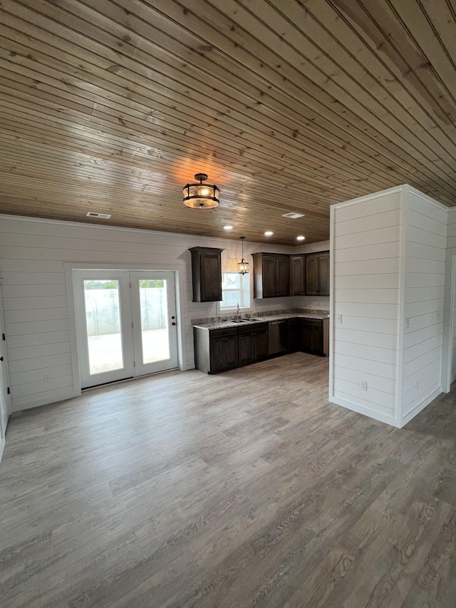 kitchen featuring light wood-type flooring, a sink, dark brown cabinets, wooden ceiling, and open floor plan