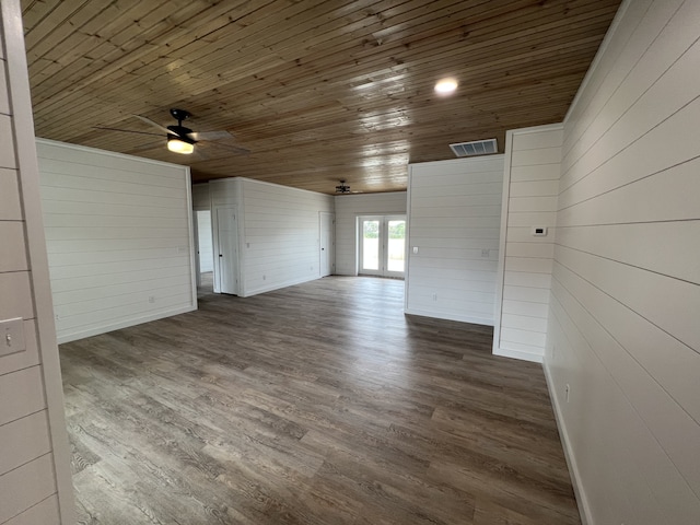 empty room with ceiling fan, wood ceiling, and wood-type flooring