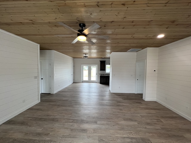 unfurnished living room featuring ceiling fan, hardwood / wood-style floors, and wooden ceiling