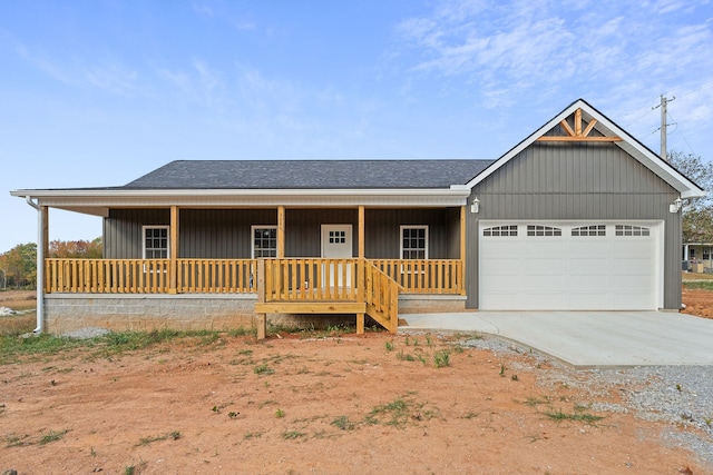 view of front of property featuring a porch and a garage