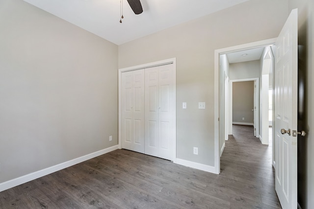 unfurnished bedroom featuring a closet, ceiling fan, and light wood-type flooring