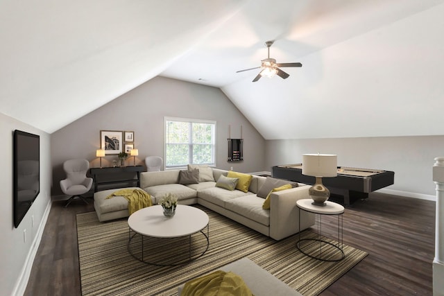 living area with baseboards, a ceiling fan, lofted ceiling, and wood finished floors