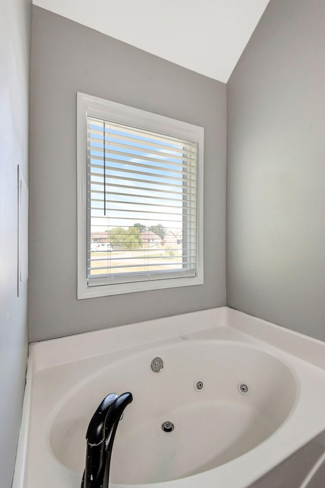 bathroom with a whirlpool tub