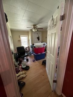 hallway with wood finished floors