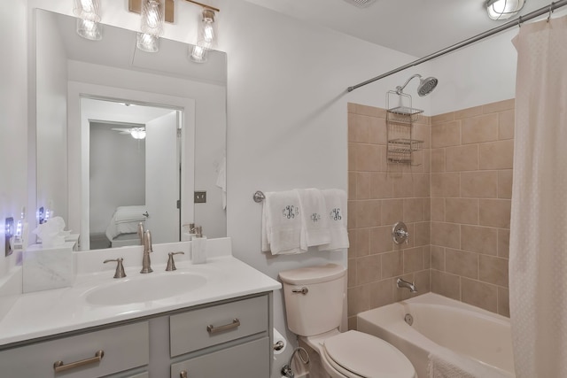 full bathroom featuring shower / bath combo with shower curtain, vanity, and toilet