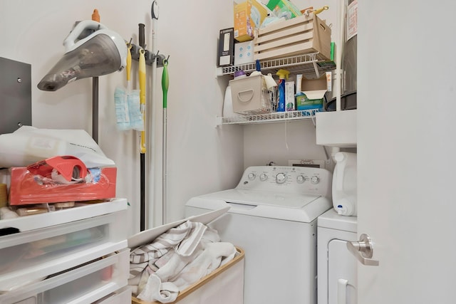 washroom featuring washing machine and dryer and laundry area