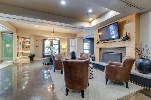 living room with an inviting chandelier