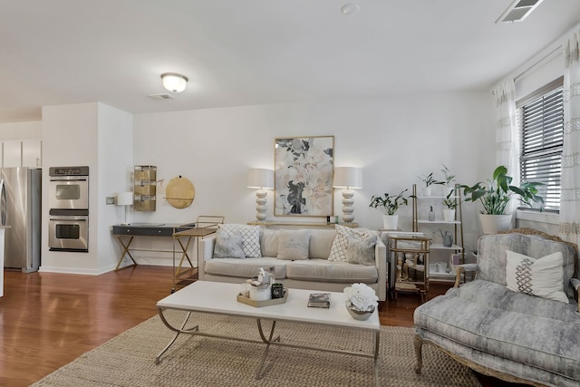 living room with dark hardwood / wood-style floors