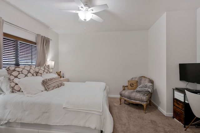 bedroom featuring ceiling fan and light carpet