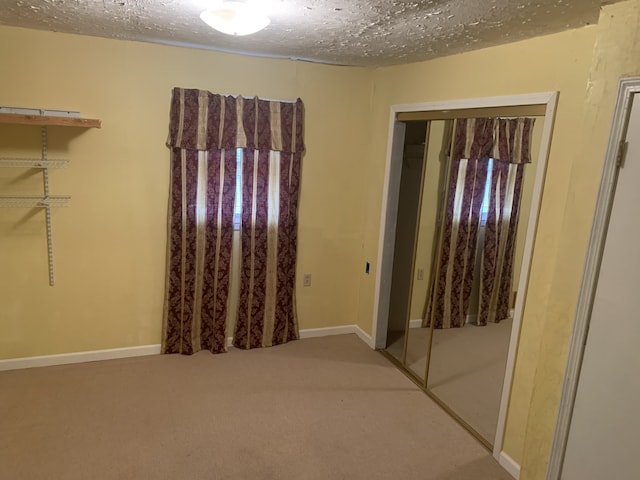 interior space featuring a textured ceiling