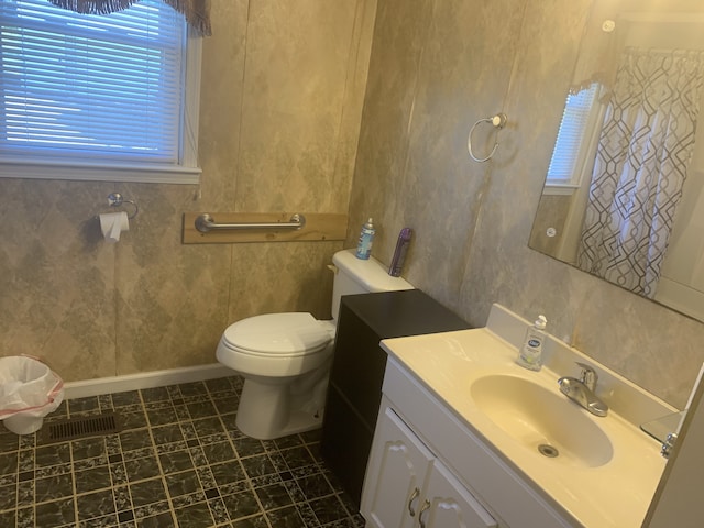 bathroom with tile patterned floors, vanity, and toilet