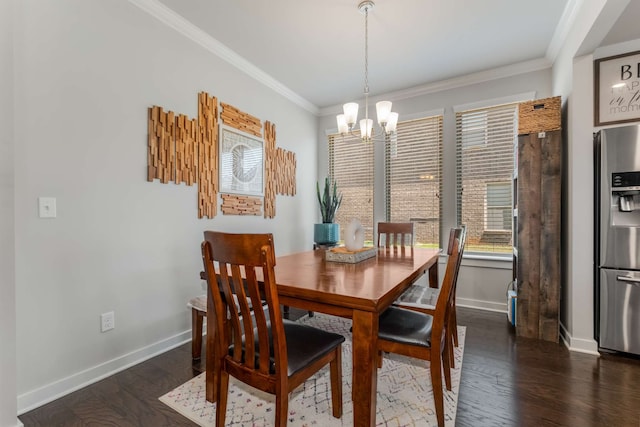 dining space featuring dark hardwood / wood-style flooring, a chandelier, and ornamental molding