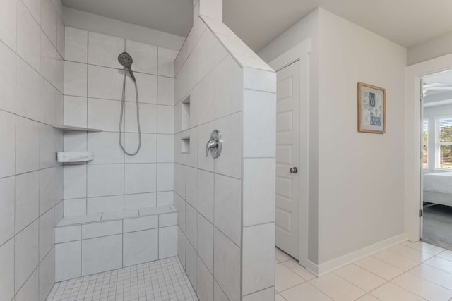 bathroom featuring tiled shower and tile patterned floors