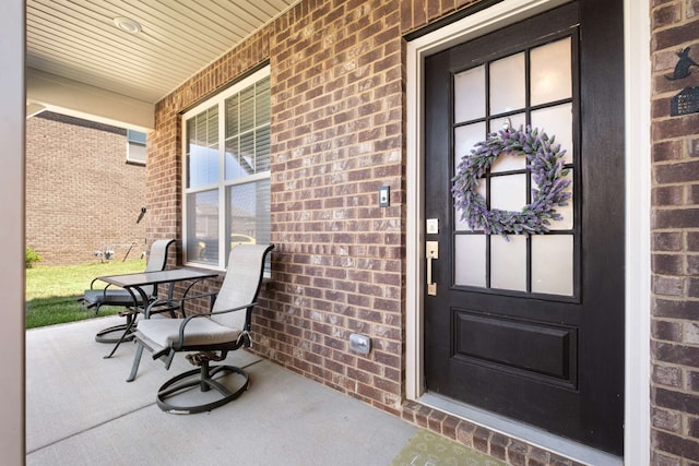 property entrance with covered porch