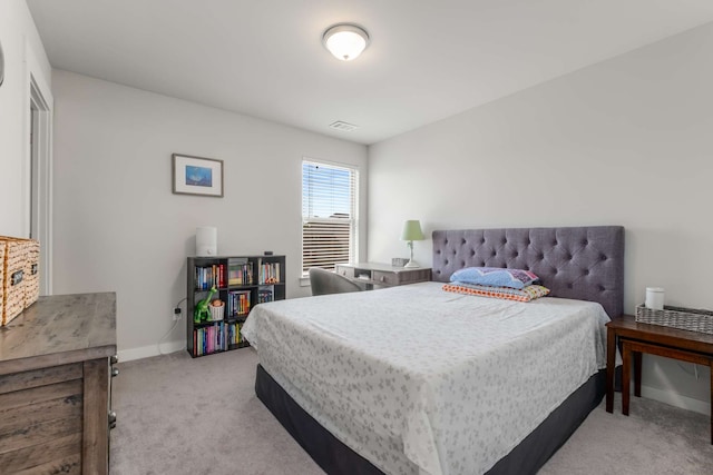 bedroom featuring light colored carpet