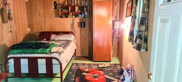 bedroom with wooden walls