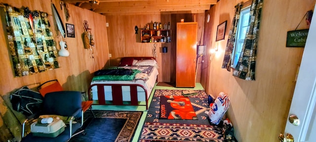 bedroom with wood walls