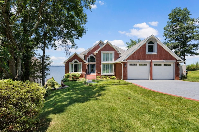 view of front of home with a garage and a front yard