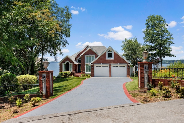 view of front of property featuring a garage and a front yard