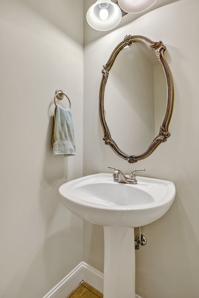 bathroom with tile patterned floors