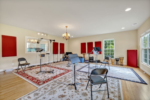 living room featuring light hardwood / wood-style floors and a chandelier