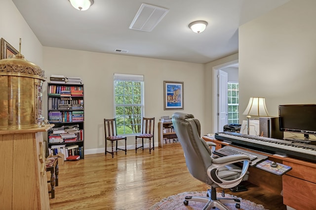 home office featuring light wood-type flooring