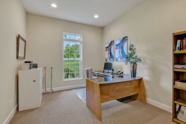 office space with light carpet and a healthy amount of sunlight