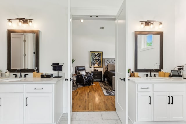 bathroom featuring hardwood / wood-style flooring and vanity