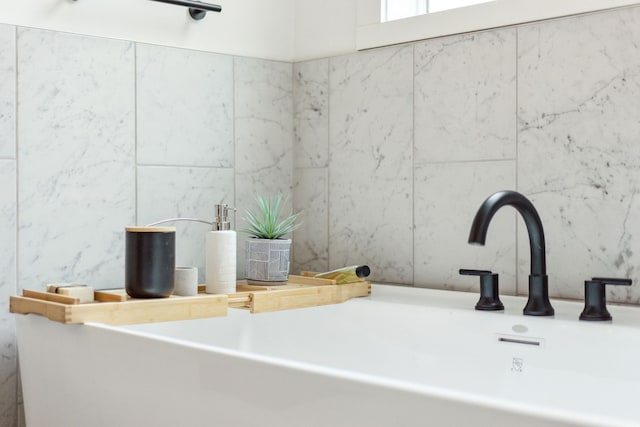 bathroom with tile walls