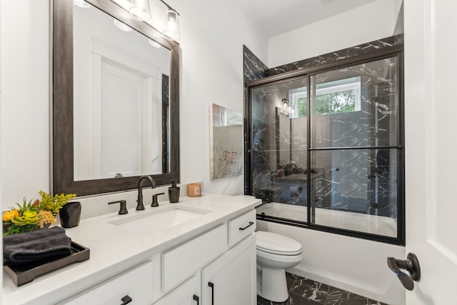 full bathroom with toilet, bath / shower combo with glass door, vanity, and tile patterned floors