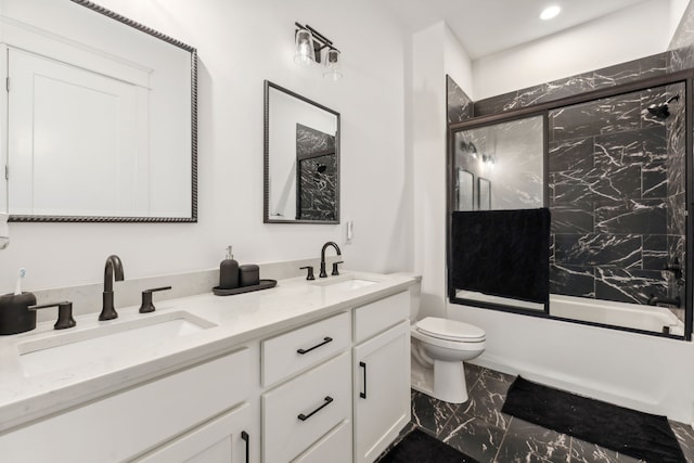 full bathroom with tile patterned flooring, shower / bath combination with glass door, toilet, and vanity