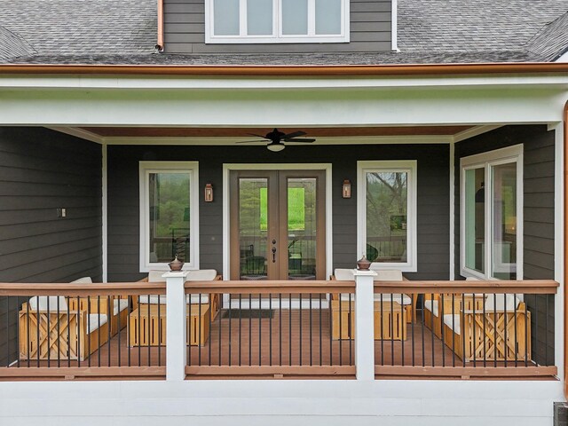 entrance to property featuring a wooden deck and ceiling fan