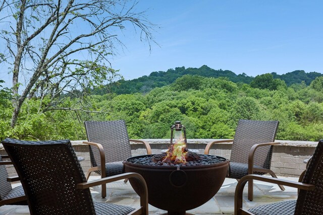 view of patio with a fire pit