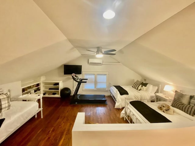 bedroom with a ceiling fan, a wall unit AC, wood finished floors, and vaulted ceiling